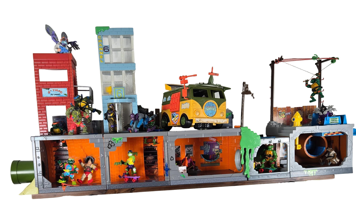 Toy display on a wall-mounted shelf with various toys and models.